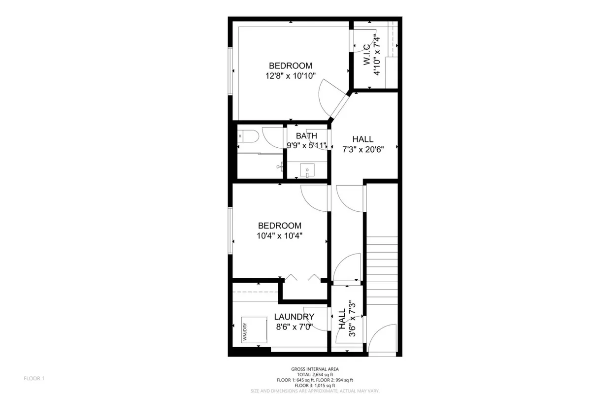This image shows a hallway leading to several bedrooms and a bathroom, with a laundry area visible as well. The rooms are warmly lit, creating a cozy and practical atmosphere. Beds are neatly made, and the bathroom appears conveniently located off the hallway, supporting both accessibility and privacy.