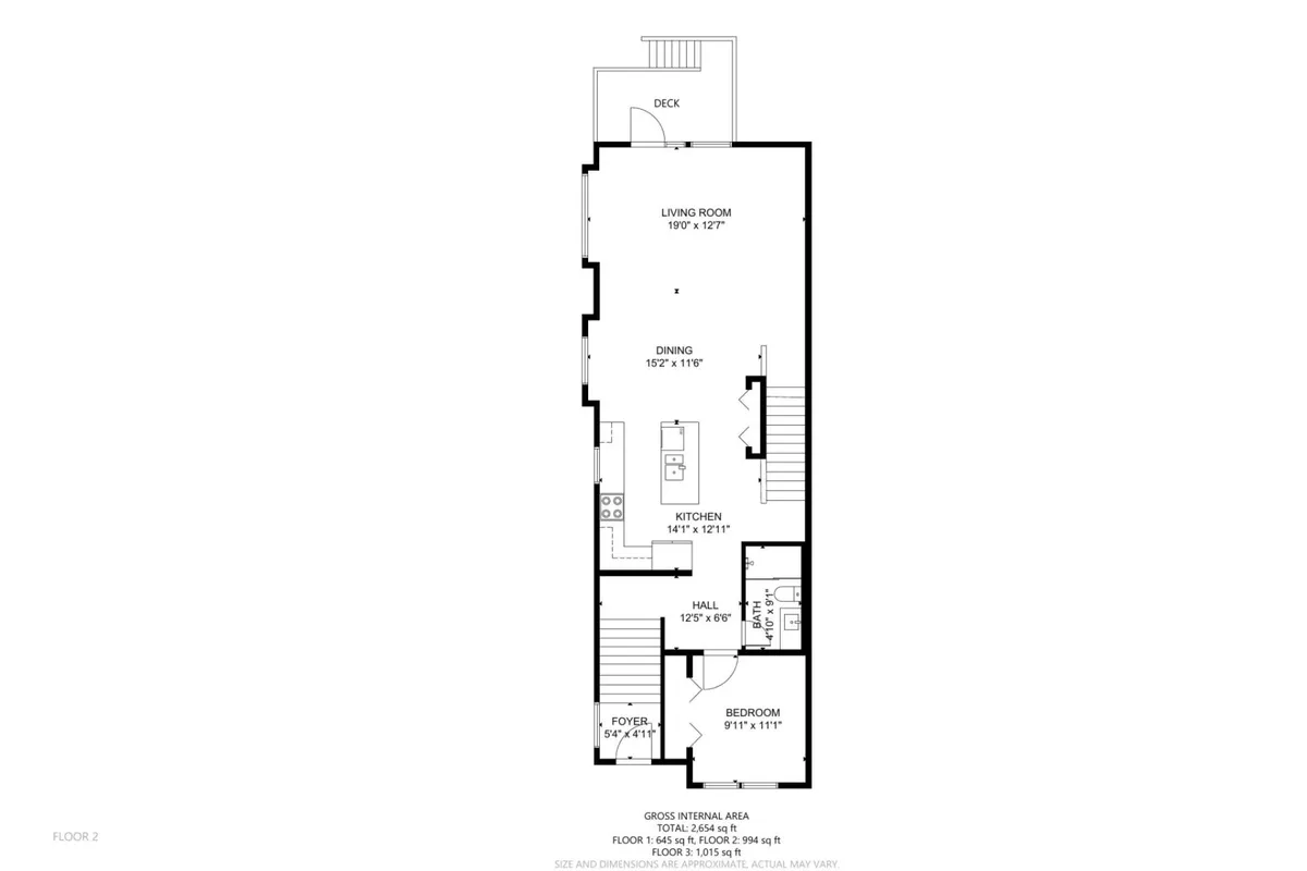 This image presents a spacious common area that seamlessly incorporates the living room, kitchen, dining area, and a deck visible through glass doors. The setup is welcoming and open, ideal for relaxing, entertaining, or gathering after a day out.
